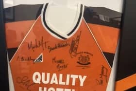 The Carrick shirt featuring Stuart's signature.