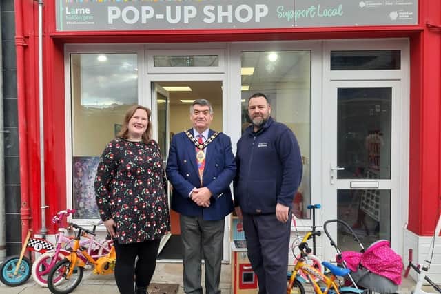 Isobel Kerr, Habitat for Humanity ReStore manager; the Mayor of Mid and East Antrim, Alderman Noel Williams and Joe Lyttle, Habitat for Humanity ReStore driver.