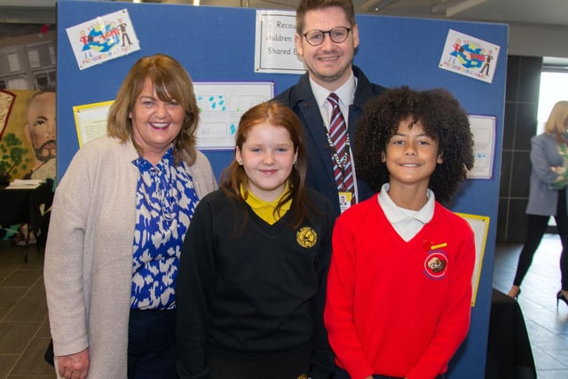 Pictured at the Hart and Presentation Primary Schools Shared Education celebration are PPS principal, Miss Yvonne Mulholland and Hart PS principal, Mr Andrew Frizzell with pupils, Olivia Stothers and Rodrigo Tavares. PT18-233.