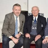 Hilbert Willis pictured at his 100th birthday party in February 2024 with Loughgall FC chairman, Councillor Sam Nicholson, left, and club president, Noel Willis. Picture: Tony Hendron