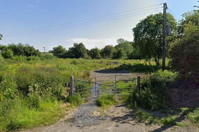 The site in question is a smaller portion of a larger field, with mature vegetation screening it from Kinnego Embankment and the M1 motorway. Image: Google