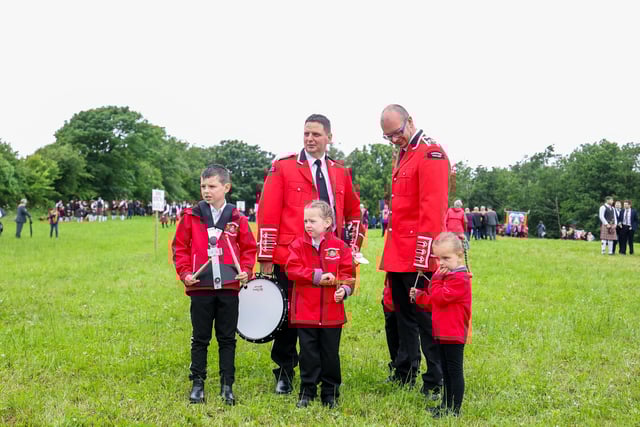 Bands members pictured in the field before the parade starts.