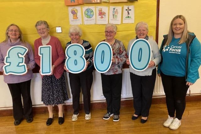 Representatives of Ballymore Parish Church, Tandragee hand over a cheque for £1,800 to Cancer Focus as a result of a coffee and craft morning.