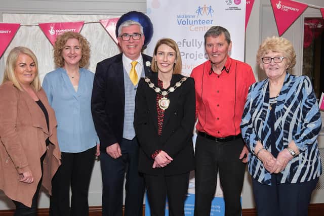 Mid Ulster Council chair Cora Corry with Mid Ulster Volunteer Centre members - Josie McGuckin (committee member), Michele McKeown (general manager) and May Devlin Chair with Gary Wilson Compere and Kenny Paul, who provided the entertainment.