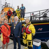 Mayor of Causeway Coast and Glens Councillor Steven Callaghan, pictured with Portrush RNLI Coxswain Des Austin, RNLI Lifeguard James Wright, RNLI Portrush crew member
Deborah Smyth and other crew members as he announces his upcoming fundraising events. Credit Causeway Coast and Glens Council