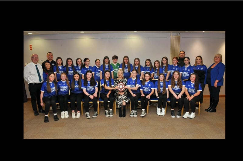 Deputy Lord Mayor, Councillor Sorcha McGeown with the Clan Na Gael, Under 12.5 Girls who won the Division One League. Included are,  Councillors, Mary O'Dowd and Liam Mackle and coaches, Diarmuid Marsden, Kathryn Barry, Jennifer O'Hanlon and Joe Lavery.
