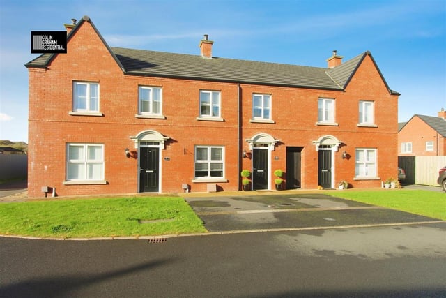 The mid town house has an attractive red brick exterior.