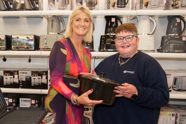 Menarys area manager, Aileen Murnion, left, discusses one of the store products with customer, Joanne Irwin at the opening of the new Lurgan shop. LM18-208.