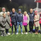Northern Trust foster carers pictured with Coleraine FC manager Dean Shiels and other club representatives.