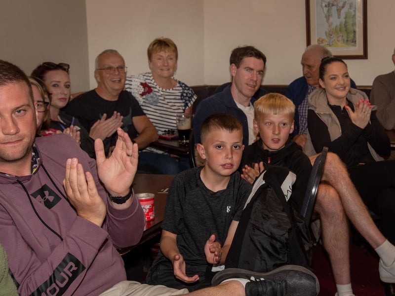 Fans at the Daniel Wiffen watch party applaud as he takes part in the 1500m Freestyle swimming final in Paris. LM32-212.