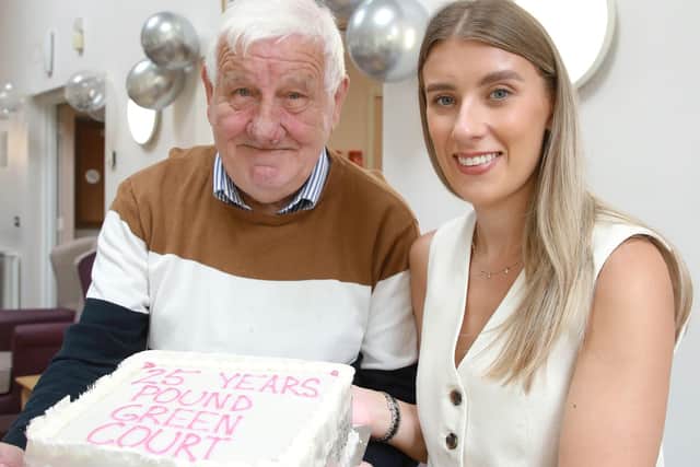 Tenant Jeff Shaw and Jessica McBride, Choice scheme co-ordinator at Pound Green Court, with a cake to mark the milestone. Photo submitted by Choice