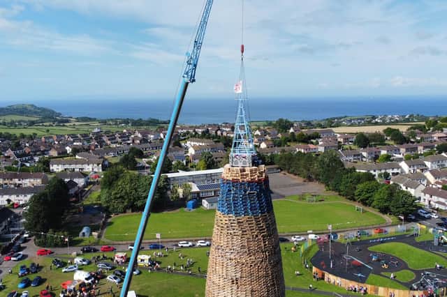 Members of the community gathered to watch the Craigyhill bonfire being completed at the weekend. Photo by:  AmandaAnne McWhinney, AWP, Bangor.