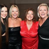 Enjoying the Seagoe Hotel Christmas party night on Saturday are friends, from left, Anna Elliott, Jill Pierson, Ruth McClung and Christine Moore. PT51-225.