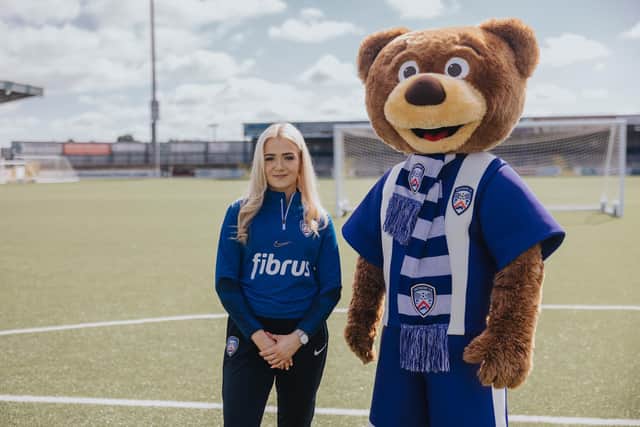 Coleraine Football Club’s Lori Watton and Benny the Bannsider. Lori is the latest superfan being highlighted by Fibrus, showing how fans are the backbone of our communities, putting a spotlight on the inspiring people behind local sports clubs in Northern Ireland. Credit David Cavan