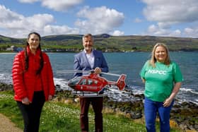 Rob McConnell pictured with representatives from the Air Ambulance NI and the NSPCC. Picture by Phil Magowan / Press Eye.