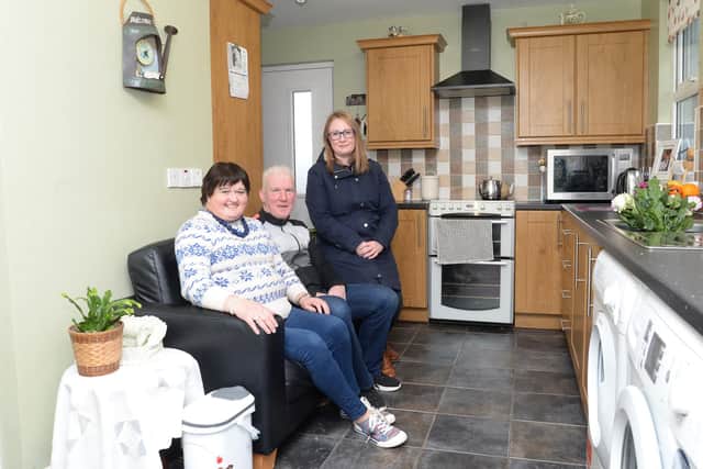 Tenants Michael and Geraldine Crilly are proud to welcome Joanne White, Housing Executive Patch Manager (far right) into the new kitchen of their Dunloy home which benefitted from an extensive Housing Executive thermal upgrade scheme worth £1.4million. CREDIT NIHE