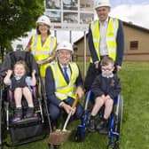 Education Minister Paul Givan cuts the first sod for the project at Kilronan School.  Included, from left to right, are the principal Sharlene Deehan; pupil Grace; Damien Mitchell, vice chair of the board of governors and pupil Bobby. Photo provided by Department of Education