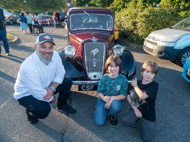 Admiring a 1939 Austin 7 are Jonathan Hanssen and his sons Declan (9) and Blake (8).