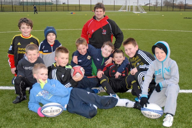Gareth Wright, community rugby officer, is pictured with children who attended the rugby training session at the Cliff as part of the Larne Community Alive Sports Day. INLT 04-031-PSB