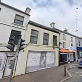 This vacant shop (yellow façade with grey shop front) is going to be extensively refurbished at 12 Main Street, Rathfriland. Credit: Google