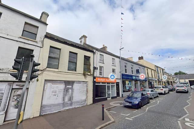 This vacant shop (yellow façade with grey shop front) is going to be extensively refurbished at 12 Main Street, Rathfriland. Credit: Google