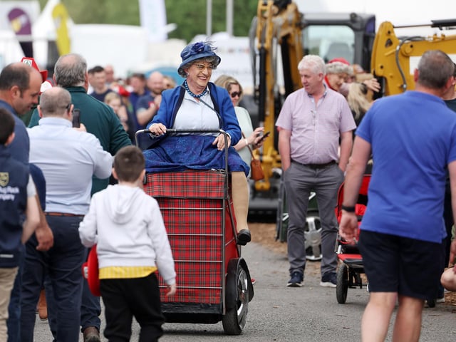 Giving the crowds a smile at the show.