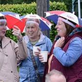 Making the best of the wet weather with smart headgear at the Randalstown Twelfth in 2023.  Picture: Arthur Allison / Pacemaker Press