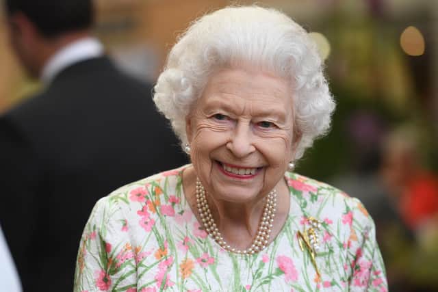 ST AUSTELL, ENGLAND - JUNE 11: Queen Elizabeth II attends an event in celebration of The Big Lunch initiative at The Eden Project during the G7 Summit on June 11, 2021 in St Austell, Cornwall, England. UK Prime Minister, Boris Johnson, hosts leaders from the USA, Japan, Germany, France, Italy and Canada at the G7 Summit. This year the UK has invited India, South Africa, and South Korea to attend the Leaders' Summit as guest countries as well as the EU. (Photo by Oli Scarff - WPA Pool / Getty Images)