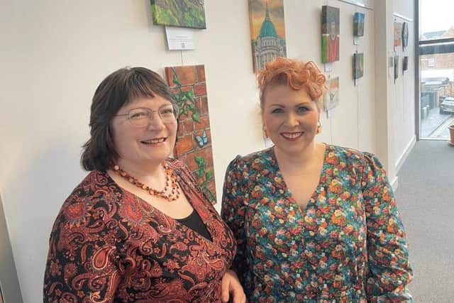 Joanne Campbell (left) has launched an art exhibition entitled ‘Springtime’ at Grove Library in North Belfast.  Photo: Christine Watson