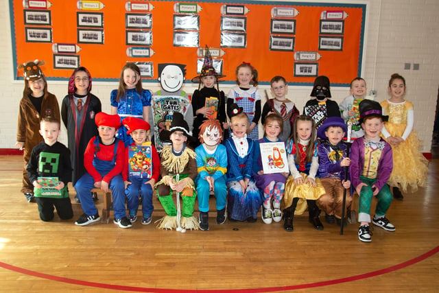 P4 pupils of St John the Baptist Primary School looking colourful in their book character costumes on World Book Day. PT10-246.