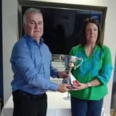 Overall winner Dianne Gallagher receives the cup from Hugo Downey
