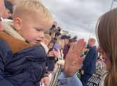 The Princess of Wales and Mason prepare to high five.