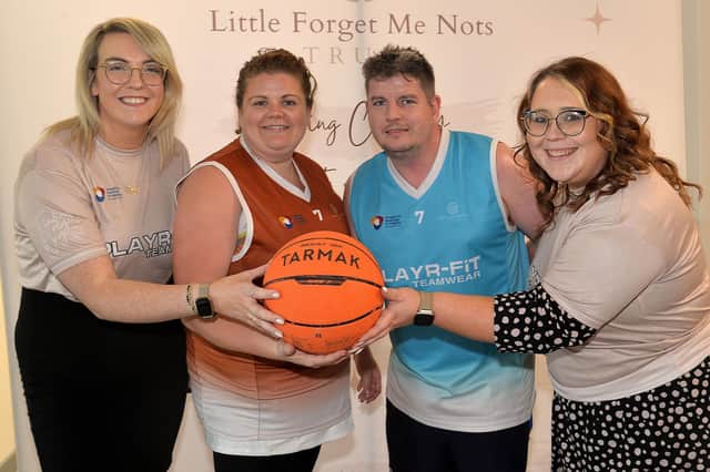 Pictured at the charity basketball tournament at South Lake Leisure Centre in Craigavon are Little Forget Me Nots charity workers, Louise Taylor, left,  charity founder, and Catherine Muldoon, right, community connections officer, with Lindsey and Paul McKenna who organised the event in memory of their baby daughter Darcy. LM42-200.