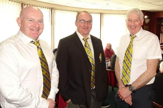 Gary McElroy (captain), DJ Wilson (president) and Myles Greenfield (past president).