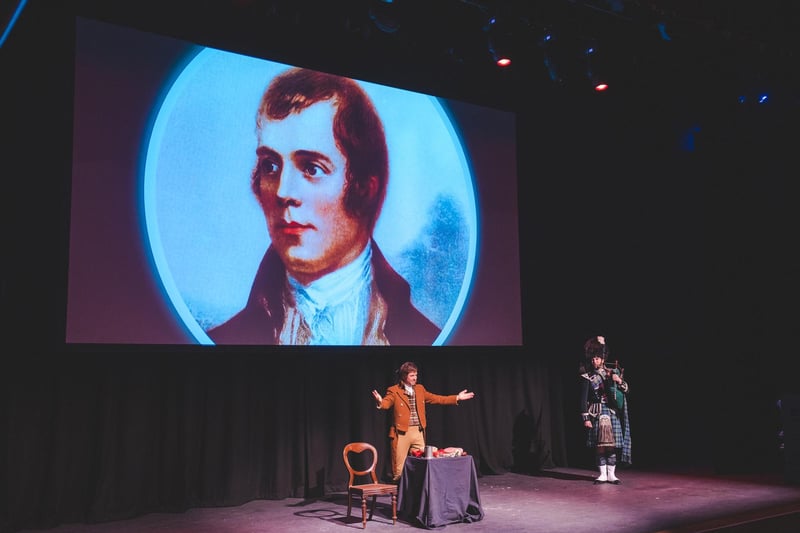 Rabbie Burns was joined on the stage by a piper.