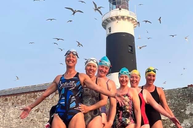 At Rockabill Lighthouse in Skerries, Co Dublin, six local women calling themselves The Grainne Ni Mhailles are pictured after they swam the 44 kilometre distance in the Irish Sea from Templetown Beach in Co Louth to the Lighthouse.