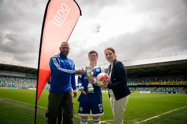 Pictured at the launch of the BDO NI Special Schools FA Cup in partnership with the Irish FA, Steven Burnett, PE Teacher at Tor Bank School, Dundonald with pupil Daniel McKee and Laura Jackson, Partner at BDO NI.