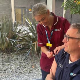 Professor David Robinson receiving his vaccination from Claire Gressani (Nurse Manager, Vaccination Programme). Picture: South Eastern Health and Social Care Trust