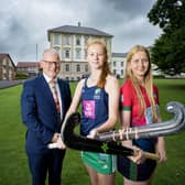 Dr David Carruthers pictured with Coleraine Grammar School hockey first XI co-captains Kia McCartney and Hope Ross. Credit Morrow Communications