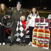 Gary Woolsey celebrates his Diemens.com sponsored National Hot Rods victory with his young family.