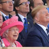 (L-R) Britain's Prince Charles, Prince of Wales, Britain's Queen Elizabeth II and US President Donald Trump look up as aircraft perform a fly-over during an event to commemorate the 75th anniversary of the D-Day landings, in Portsmouth, southern England, on June 5, 2019. - US President Donald Trump, Queen Elizabeth II and 300 veterans are to gather on the south coast of England on Wednesday for a poignant ceremony marking the 75th anniversary of D-Day. Other world leaders will join them in Portsmouth for Britain's national event to commemorate the Allied invasion of the Normandy beaches in France -- one of the turning points of World War II. (Photo by Daniel LEAL-OLIVAS / AFP)        (Photo credit should read DANIEL LEAL-OLIVAS/AFP/Getty Images)