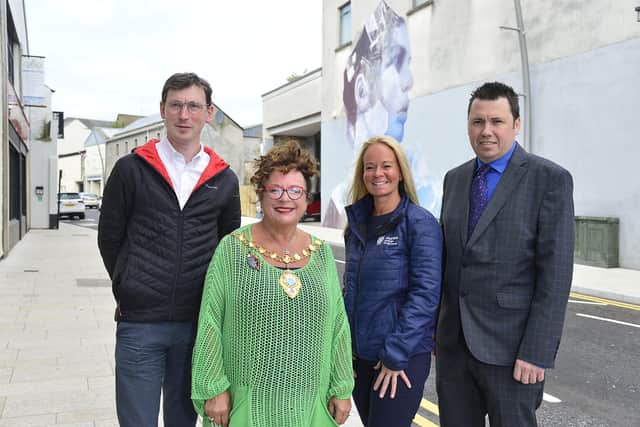 At Point Street to see the completed public realm work are Eamon McMullan, capital regeneration manager; the Mayor of Mid and East Antrim, Alderman Gerardine Mulvenna; Gail Kelly, town centre development manager and Neil Richardson, deputy director of the DfC Regional Development Office.