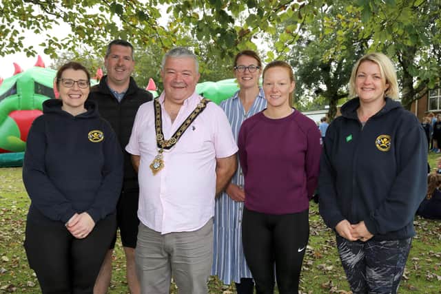 The Mayor of Causeway Coast and Glens Borough Council, Councillor Ivor Wallace, alongside Ms Steele, Principal of Armoy Primary School, Gerard McIlroy, Good Relations Officer, Causeway Coast and Glens Borough Council,  Straidbilly Primary School teacher, Mrs Vandevyver, St. Olcan’s Primary School teacher Mrs Gillan and Mrs Wall from Armoy Primary School who arranged the joint event held in Armoy Primary School.