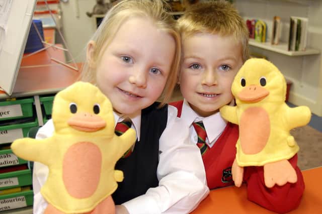 Working hand In glove...New P1 pupils at Cope Primary School, Loughgall Alice Berry and Leo Graham had great fun learning using hand puppets in their first days at school in 2007.