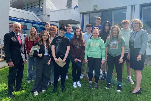 Craigavon Senior High School principal Ruth Harkness and Mr B Mullholland, Chairperson of the Education Authority celebrate with the top performing students.