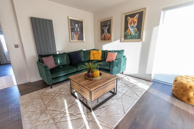 This bright family room, complete with electric blinds, could be used as another ground floor bedroom.