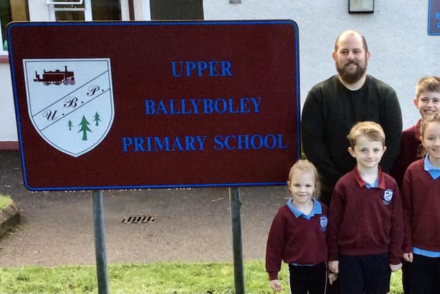 Mr Stringer, pictured with pupils after taking up the Principal's post at Upper Ballyboley PS. (Pic: Contributed).