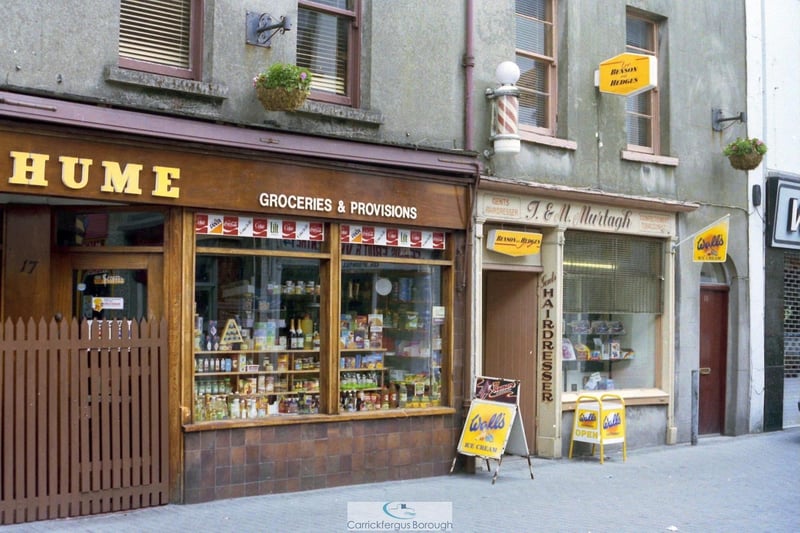 A first haircut at Terry Murtagh's was followed by many more over the years. The West Street barber's shop was an institution. So too was William Hume's Delicatessen. Long before the advent of the modern 'deli', the precisely stocked shelves were a visual feast for the customer whether on a weekday errand or stocking up on Saturday in a bustling town centre. Both men were awarded the freedom of the legacy Carrickfergus Borough Council.