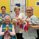 Mary pictured centre with Irene Watterson (Meeter/Greeter, Trust Volunteer Services), Charlotte Turpitt (Staff Nurse, Craig Ward ), Gillian Sinclair (Health Play Specialist, Craig Ward) , Sharon Pauley (Health Play Specialist, Maynard Sinclair Ward). Pic credit: SEHSCT