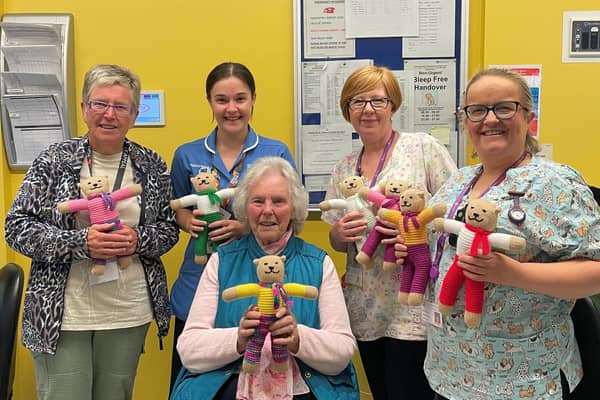 Mary pictured centre with Irene Watterson (Meeter/Greeter, Trust Volunteer Services), Charlotte Turpitt (Staff Nurse, Craig Ward ), Gillian Sinclair (Health Play Specialist, Craig Ward) , Sharon Pauley (Health Play Specialist, Maynard Sinclair Ward). Pic credit: SEHSCT